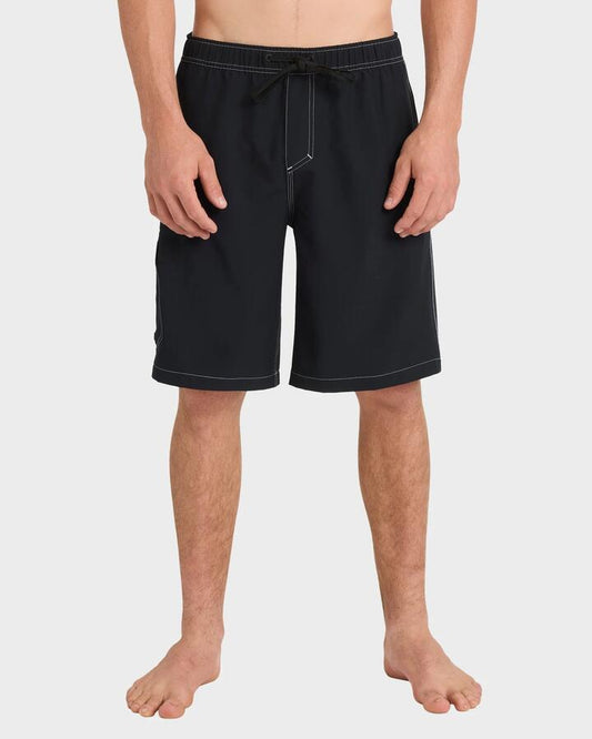 Image of a model wearing Shorts. Productname: Quiksilver Mens Exhibit Volley 21" Swim Shorts Black - in Black colour by brand - Quiksilver