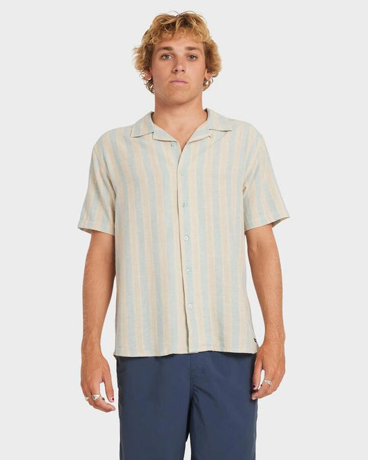 Image of a model wearing Tops. Productname: RVCA - Mens Beat Stripe Short Sleeve Shirt - Chambray - in Chambray colour by brand - RVCA
