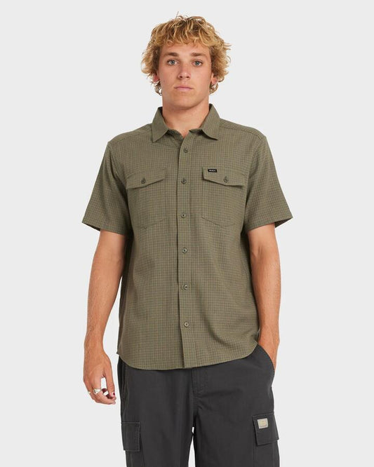 Image of a model wearing Tops. Productname: RVCA - Mens Costa Plaid Short Sleeve Shirt - Sage Leaf - in Sage Leaf colour by brand - RVCA
