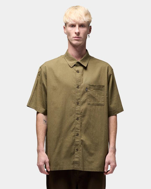 Image of a model wearing Tops. Productname: former - Mens Legacy Short Sleeve Shirt - Surplus - in Surplus colour by brand - former