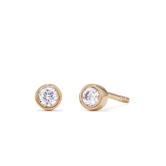 Image of Earrings. Productname: 4mm Bezel Set Cubic Zirconia Stud Earrings in 18kt Gold Plated Sterling Silver in colour by brand - Bevilles