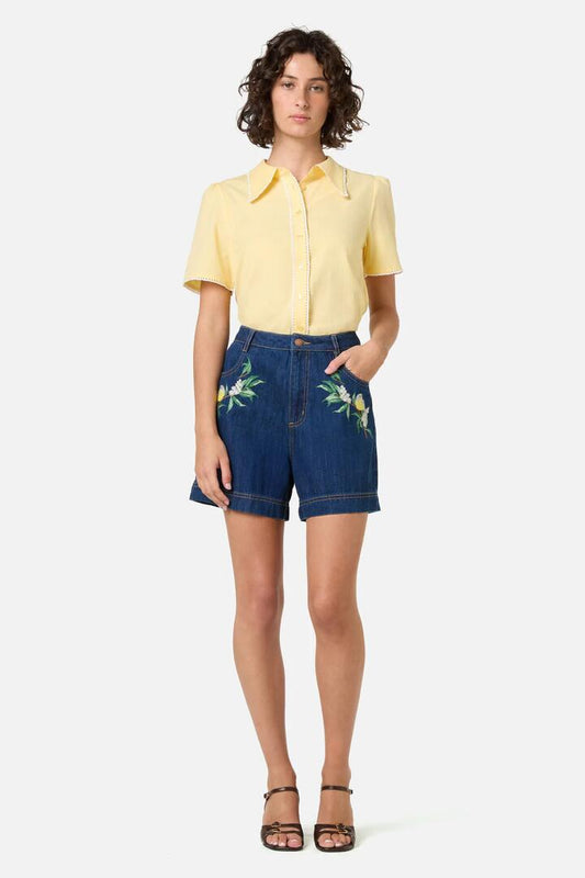 Image of a model wearing Shorts. Productname: Robin Embroidered Denim Short in Blue Denim colour by brand - Princess Highway