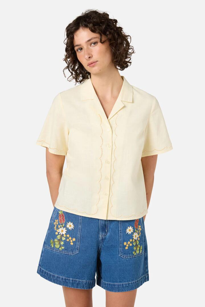 Image of a model wearing Tops. Productname: Scallop Trim Summer shirt in Yellow colour by brand - Princess Highway