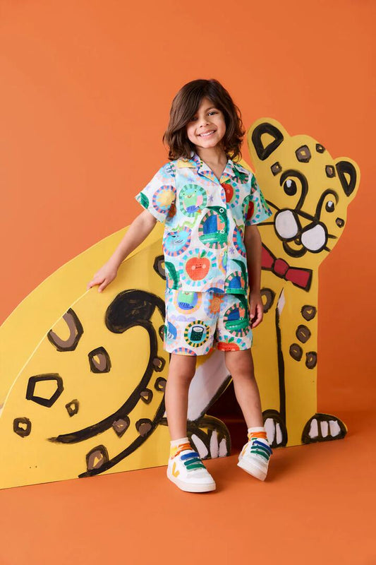 Image of a model wearing Shorts. Product name - Animal Stamp Kids Shorts in Cream colour by brand - Gorman