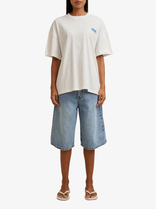 Image of a model wearing Tops. Productname: Doucette Unisex Swell Box Tee in Ivory colour by brand - Doucette