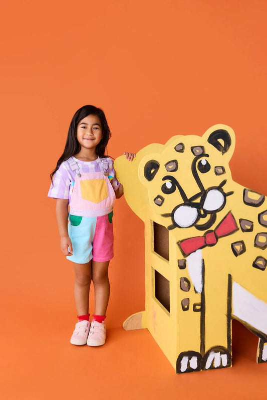 Image of a model wearing Pants. Product name - Colour Block Kids Overalls Pink in Multi colour by brand - Gorman