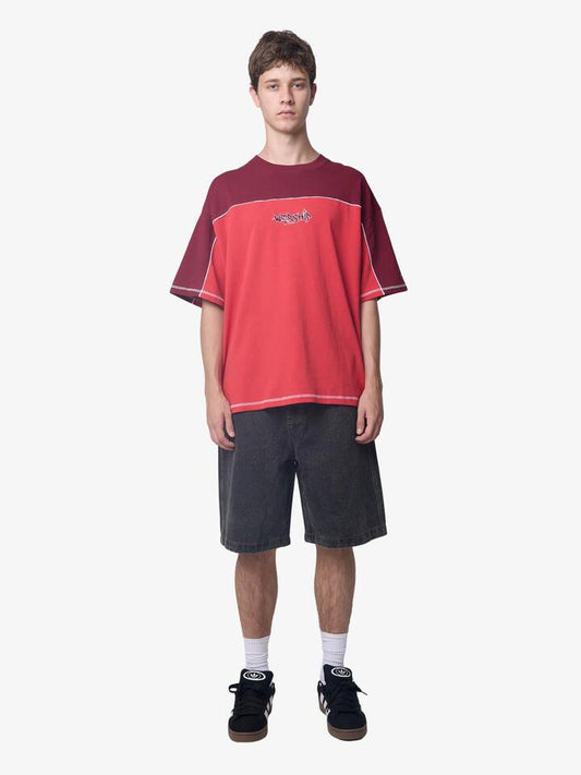 Image of a model wearing Tops. Productname: Worship Hot Gossip Oversize Panel Tee in Lucky Red colour by brand - Worship