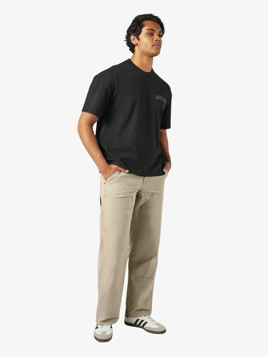Image of a model wearing Tops. Productname: Dickies Decartuville Tee in Black colour by brand - Dickies
