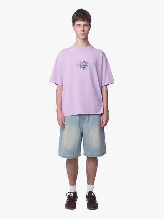 Image of a model wearing Tops. Productname: Thrills Peace Power Embro Box Crop Tee in Lupine colour by brand - Thrills