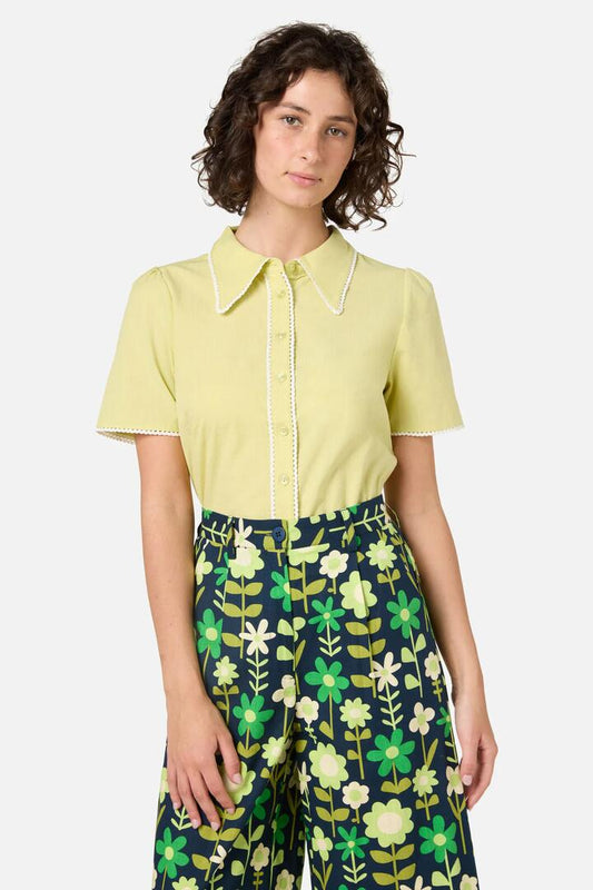 Image of a model wearing Tops. Productname: Lucy Retro Short Sleeve Blouse in Lemon colour by brand - Princess Highway