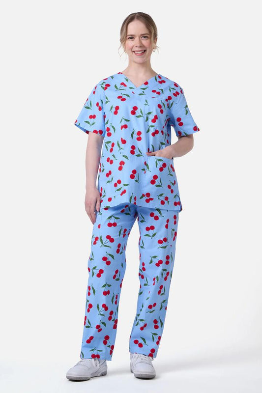 Image of a model wearing Uniforms & Workwear. Productname: Cherry Scrub Set in Blue colour by brand - Scrubs With Love