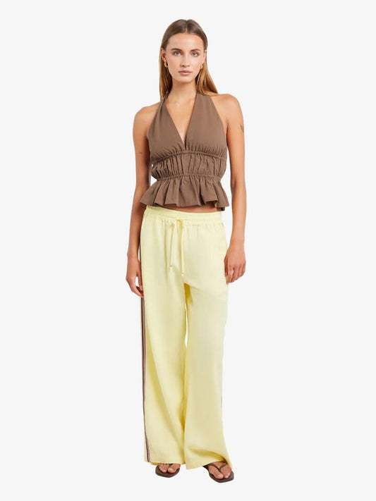 Image of a model wearing Pants. Productname: LIIDO Lune Linen Pants in Butter colour by brand - LIIDO