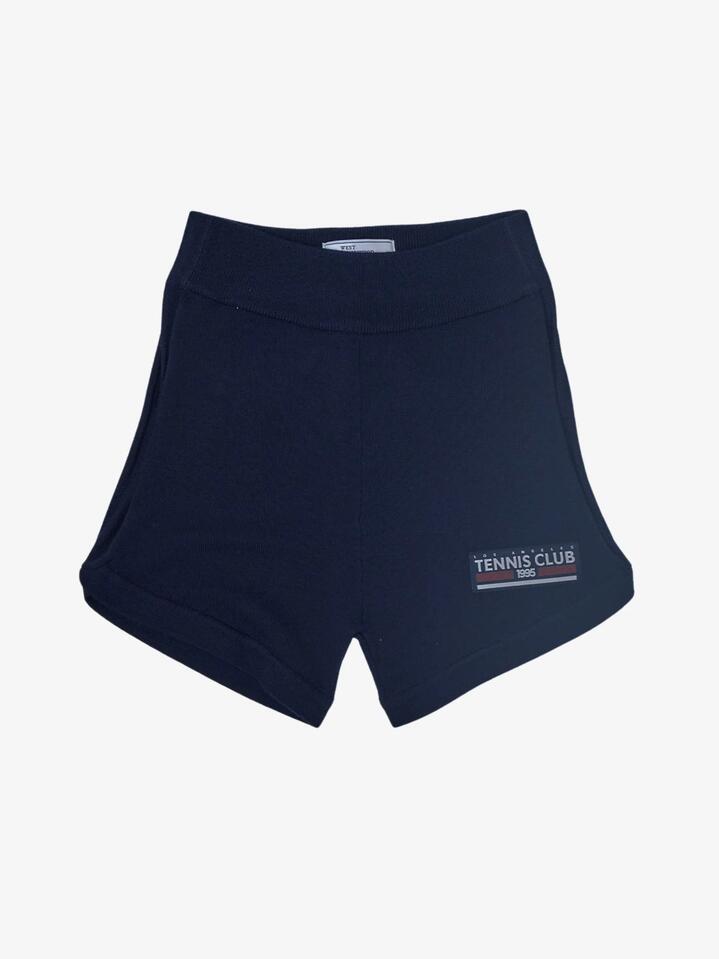 Image of a model wearing Shorts. Productname: West Hollywood Sweat Club 1995 Tennis Club Knitted Shorts in Navy colour by brand - West Hollywood Sweat Club