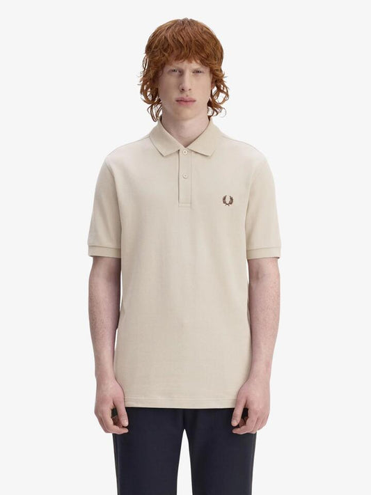Image of a model wearing Tops. Productname: Fred Perry The Fred Perry Shirt in Warm Oat/Burnt Tobacco colour by brand - Fred Perry