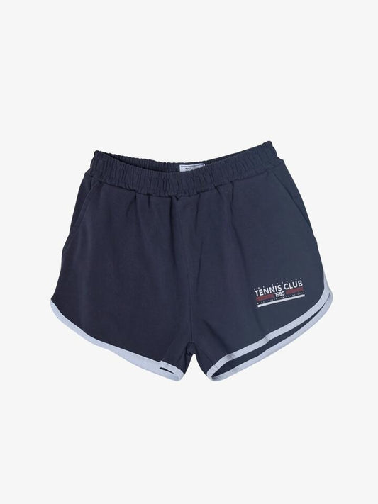 Image of a model wearing Outerwear. Productname: West Hollywood Sweat Club 1995 Tennis Club Scalloped Sweatshorts in Navy/White colour by brand - West Hollywood Sweat Club