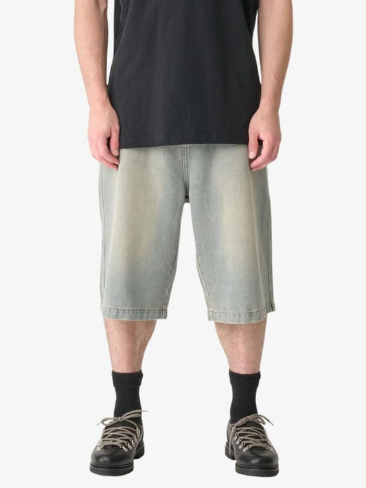 Image of a model wearing Shorts. Productname: Xlarge Baggy Bull Denim 91 Shorts in Stained Blue colour by brand - Xlarge