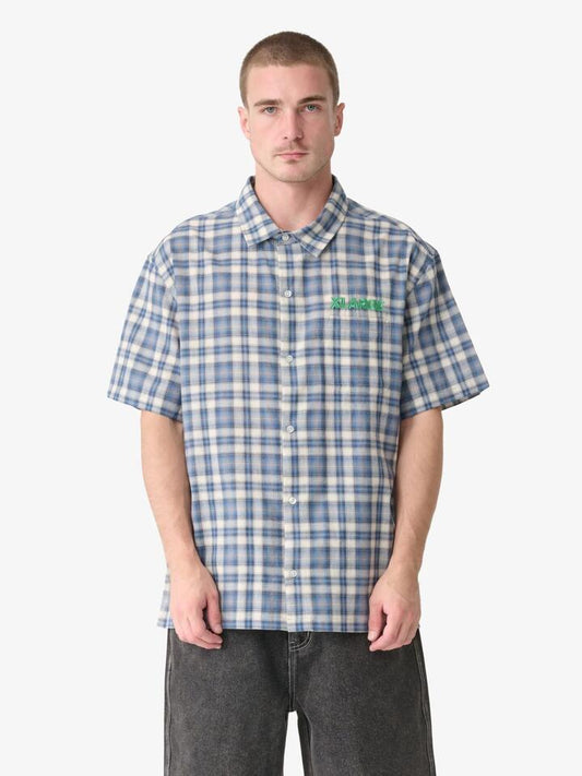 Image of a model wearing Tops. Productname: Xlarge Snooze Ss Shirt in Dusty Navy colour by brand - Xlarge