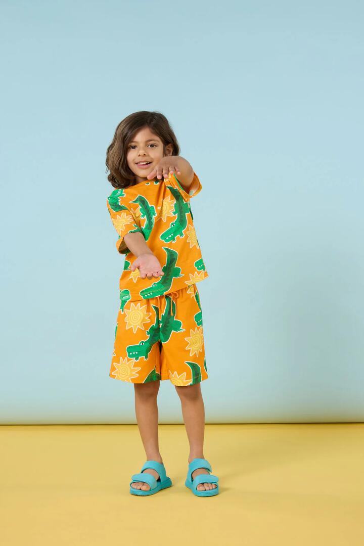Image of a model wearing Shorts. Productname: Sunny Croc Kids Shorts in Orange colour by brand - Gorman