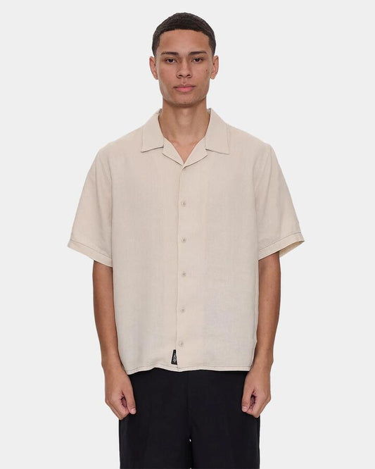 Image of a model wearing Tops. Productname: thrills - Mens Hemp Minimal Thrills Contrast Stitch Short Sleeve Shirt - Oatmeal - in Oatmeal colour by brand - thrills