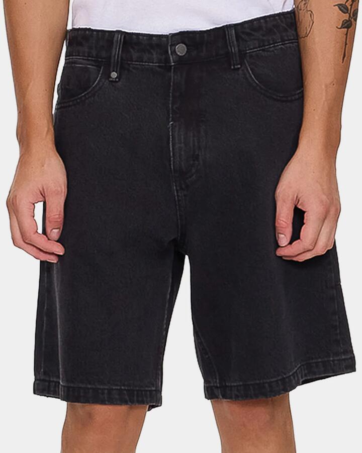 Image of a model wearing Shorts. Product name - Thrills Mens Slacker Mid Denim Shorts Aged Black in Aged Black colour by brand - Thrills