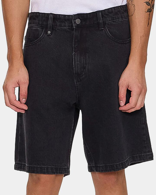Image of a model wearing Shorts. Product name - Thrills Mens Slacker Mid Denim Shorts Aged Black in Aged Black colour by brand - Thrills