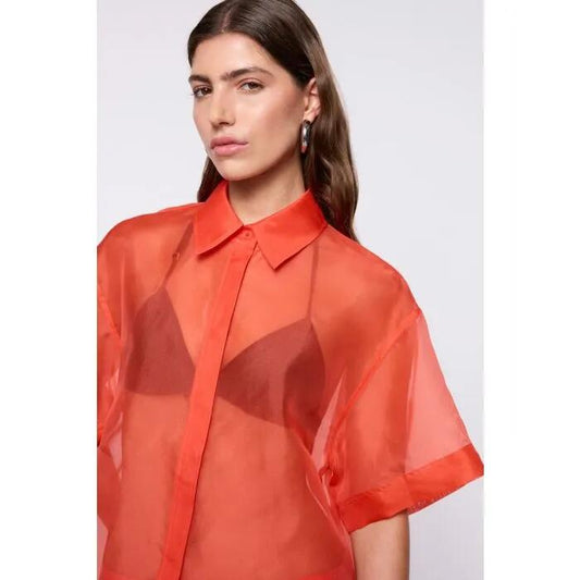 Image of a model wearing Tops. Productname: Camille Organza Shirt in Tangerine colour by brand - sass and bide