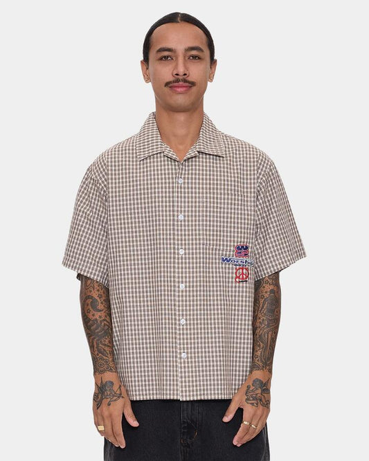 Image of a model wearing Tops. Productname: worship - Mens Low Goes Short Sleeve Shirt - Brown - in Brown colour by brand - worship