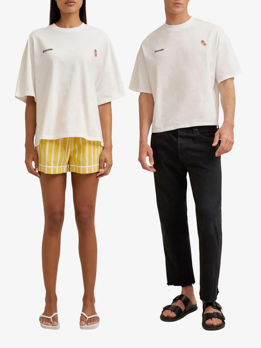 Image of a model wearing Tops. Productname: Doucette Unisex Peachy Compact Tee in Ivory colour by brand - Doucette