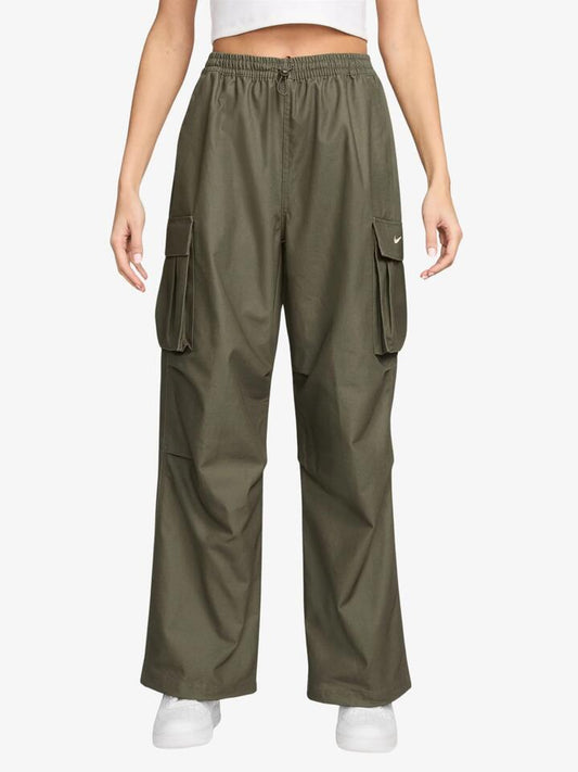 Image of a model wearing Pants. Productname: Nike Womenâs Mid-Rise Oversized Woven Cargo Pants in Medium Olive/Sail colour by brand - Nike