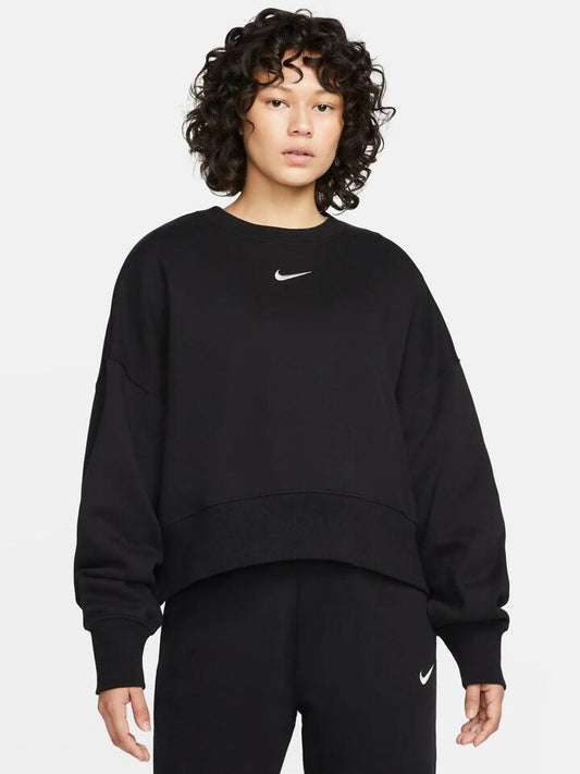 Image of a model wearing Outerwear. Productname: Nike Sportswear Phoenix Fleece Oversized Crew in Black colour by brand - Nike