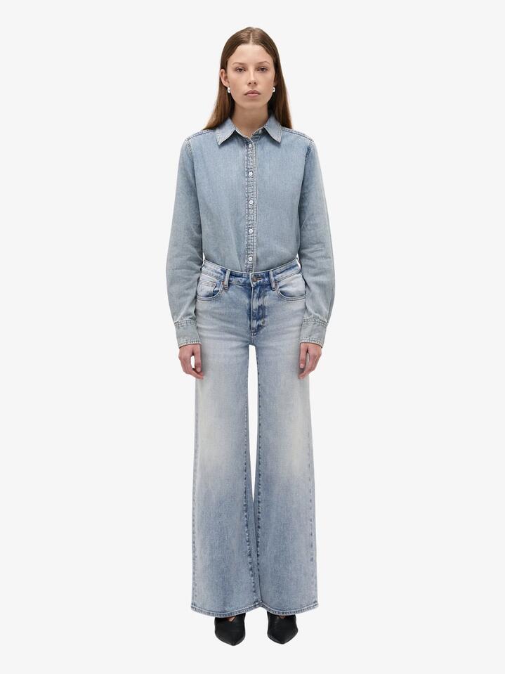 Image of a model wearing Denim. Productname: Eva Wide Fast Lane Jeans in Light Vintage Indigo colour by brand - Neuw