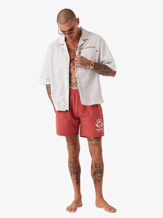 Image of a model wearing Shorts. Productname: Zanerobe Crest Balmoral Beach Shorts in Cherry colour by brand - Zanerobe