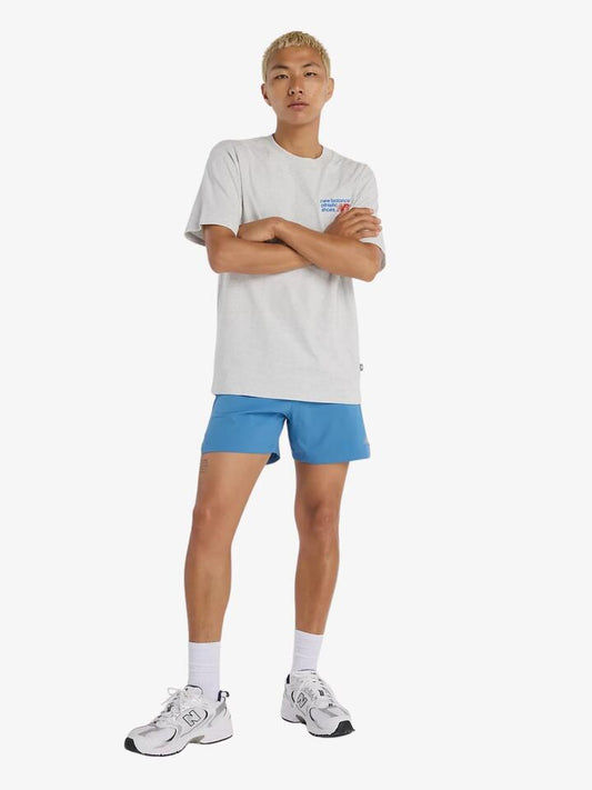 Image of a model wearing Tops. Productname: New Balance Logo Integrated Tee in Ash Heather colour by brand - New Balance