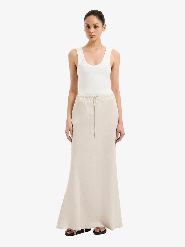 Image of a model wearing Skirts. Productname: Nude Lucy Amani Linen Skirt in Natural colour by brand - Nude Lucy
