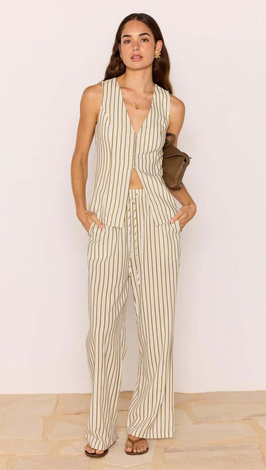 Image of a model wearing Pants. Product name - Olive & White Stripe Cotton Blend Relaxed Pant in White/Olive Stripe colour by brand - MINKPINK