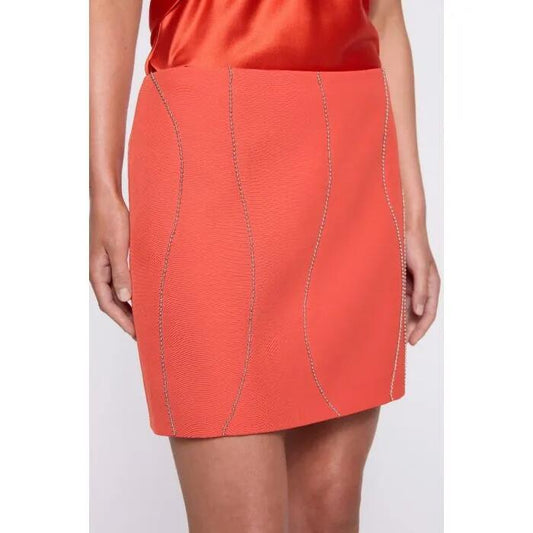 Image of a model wearing Skirts. Productname: Camille Mini Skirt in Tangerine colour by brand - sass and bide