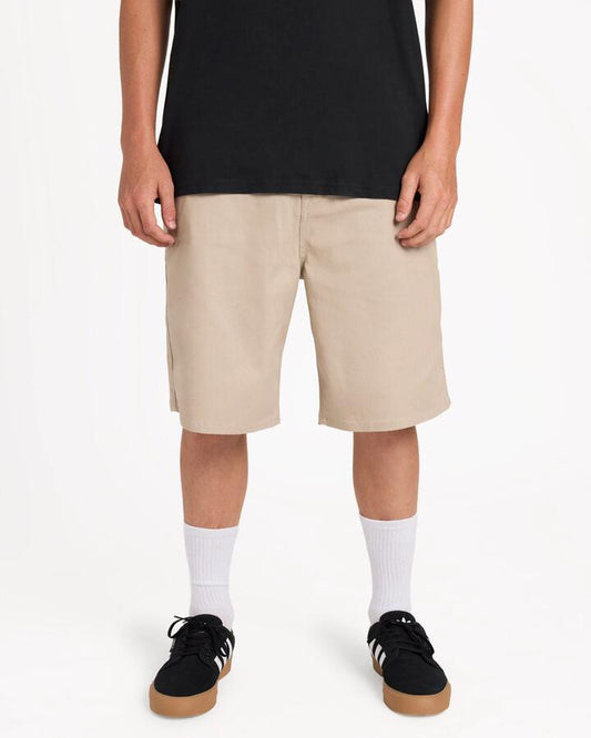 Image of a model wearing Shorts. Product name - Volcom Mens Billow 22" Walkshorts Light Khaki in Light Khaki colour by brand - Volcom