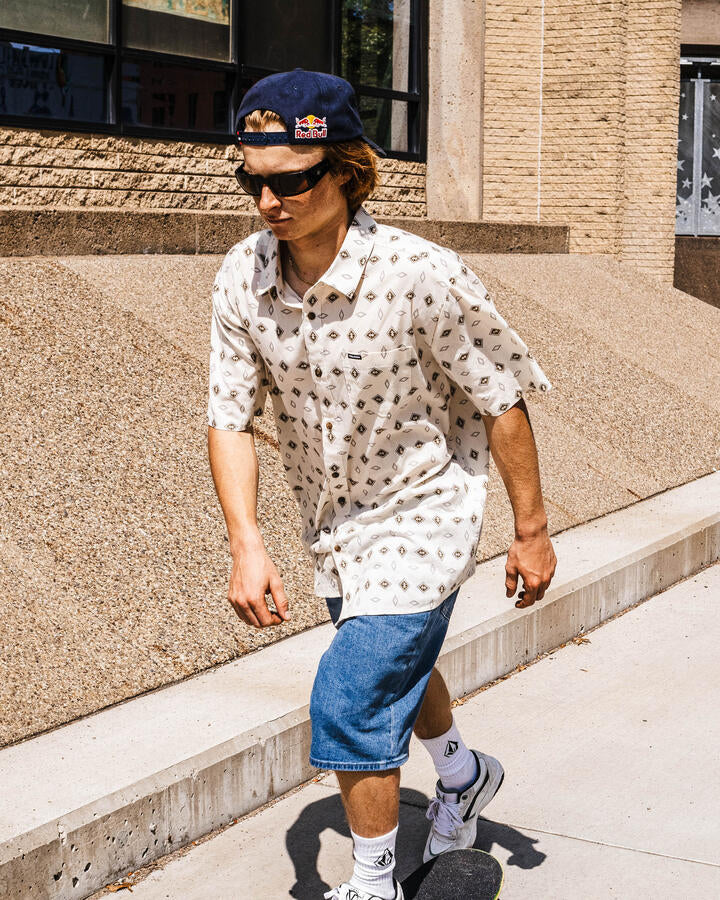 Image of a model wearing Tops. Productname: Volcom Mens Trusted Short Sleeve Shirt White Print - in White Print colour by brand - Volcom