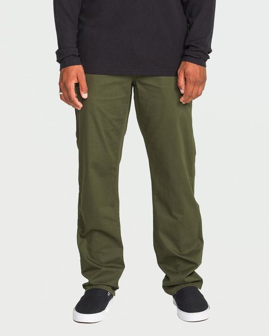 Image of a model wearing Pants. Productname: Volcom Mens Tustin Utility Carpenter Pants Duffle Bag - in Duffle Bag colour by brand - Volcom