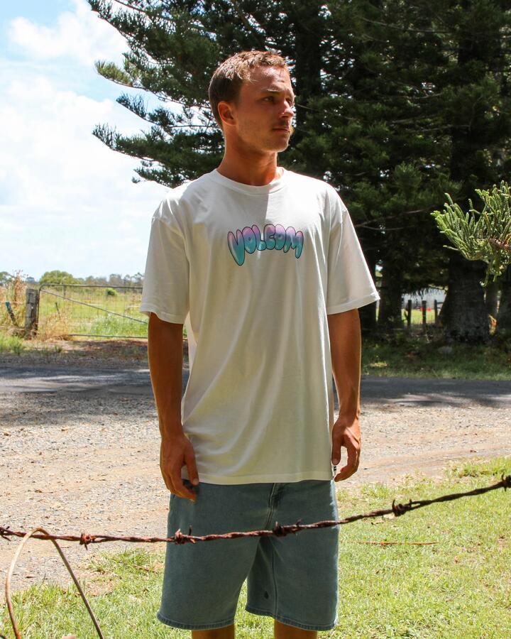 Image of a model wearing Tops. Productname: Volcom Mens Featured Artist Ozzy Summa T-Shirt Off White - in Off White colour by brand - Volcom