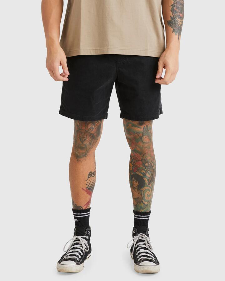 Image of a model wearing Shorts. Product name - RVCA Mens Escape Elastic Cord Ii Walkshorts Black in Black colour by brand - RVCA