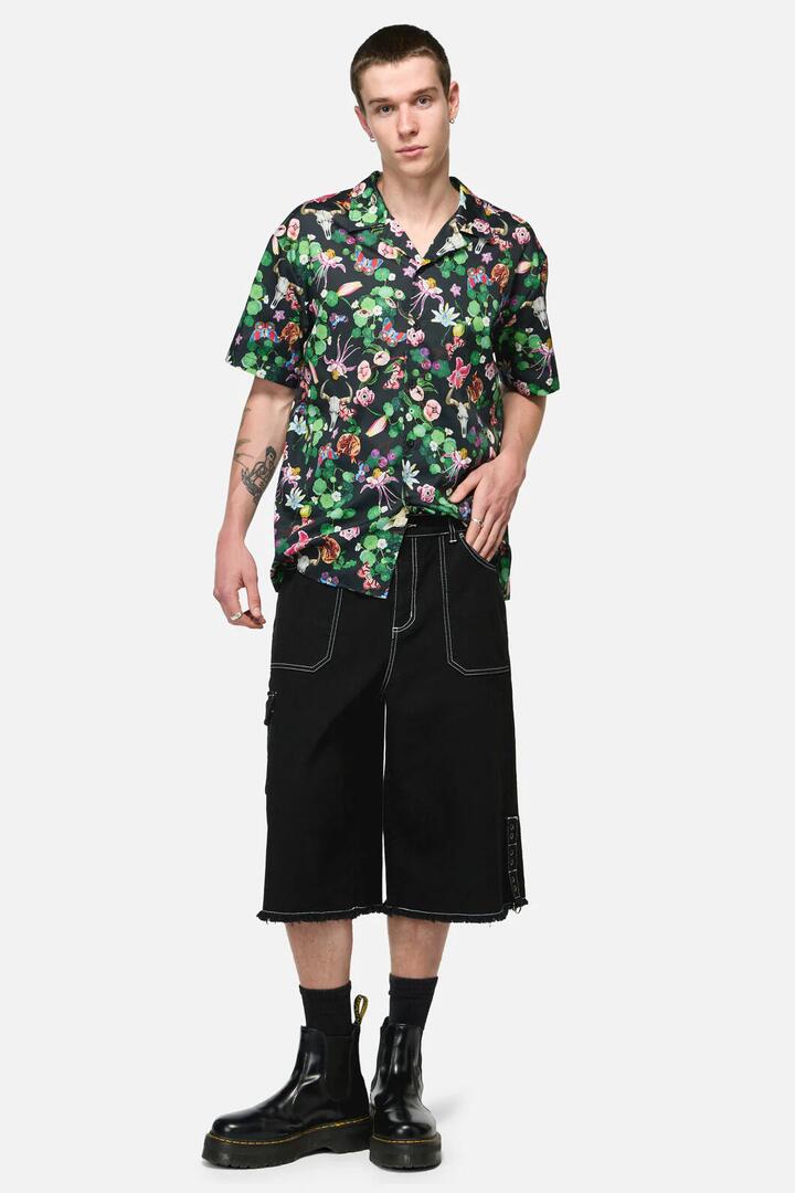 Image of a model wearing Shorts. Productname: Curse Grunge Jorts in Black colour by brand - Black Friday