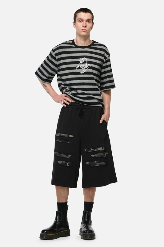 Image of a model wearing Shorts. Productname: Disruptive Cutout Camo Shorts in Black colour by brand - Dangerfield