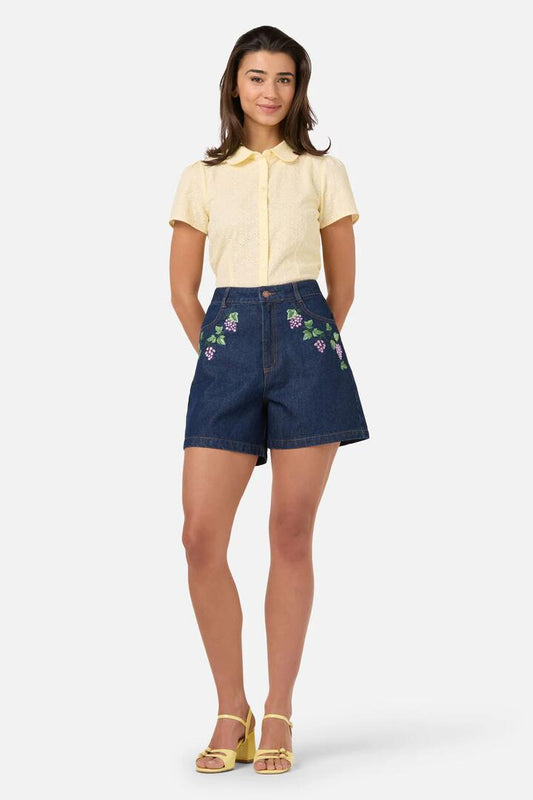 Image of a model wearing Shorts. Productname: Grapes Embroidered Denim Short in Blue Denim colour by brand - Princess Highway