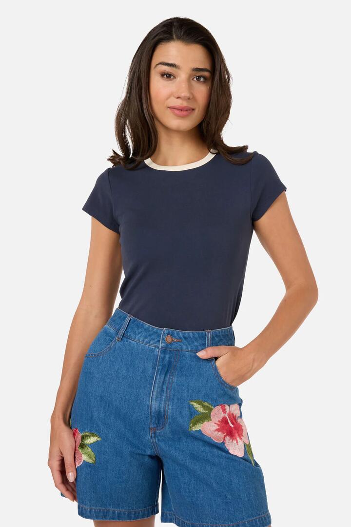Image of a model wearing Tops. Productname: Jodie Contrast Bind Ringer Tee in Navy/Cream colour by brand - Princess Highway