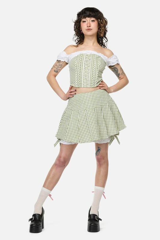 Image of a model wearing Skirts. Productname: Ladybug Cottagecore Skort in Green/Cream colour by brand - Dangerfield