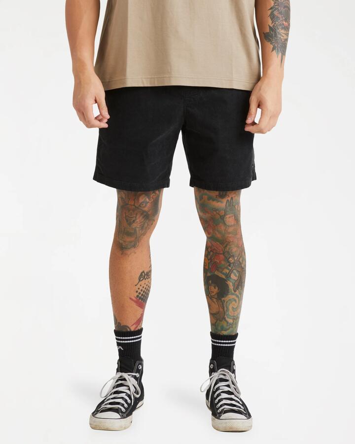 Image of a model wearing Shorts. Product name - RVCA Mens Escape Elastic Cord Ii Walkshorts Black in Black colour by brand - RVCA