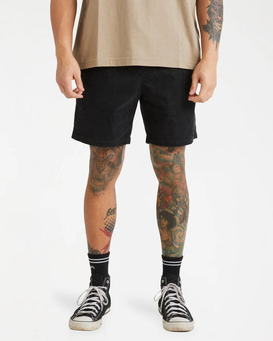 Image of a model wearing Shorts. Product name - RVCA Mens Escape Elastic Cord Ii Walkshorts Black in Black colour by brand - RVCA