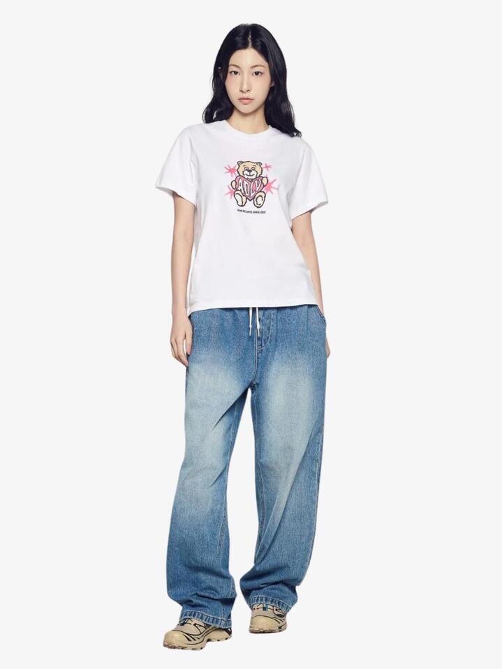 Image of a model wearing Tops. Productname: ADLV Women's Ac Bear Heart T-Shirt in White colour by brand - ADLV