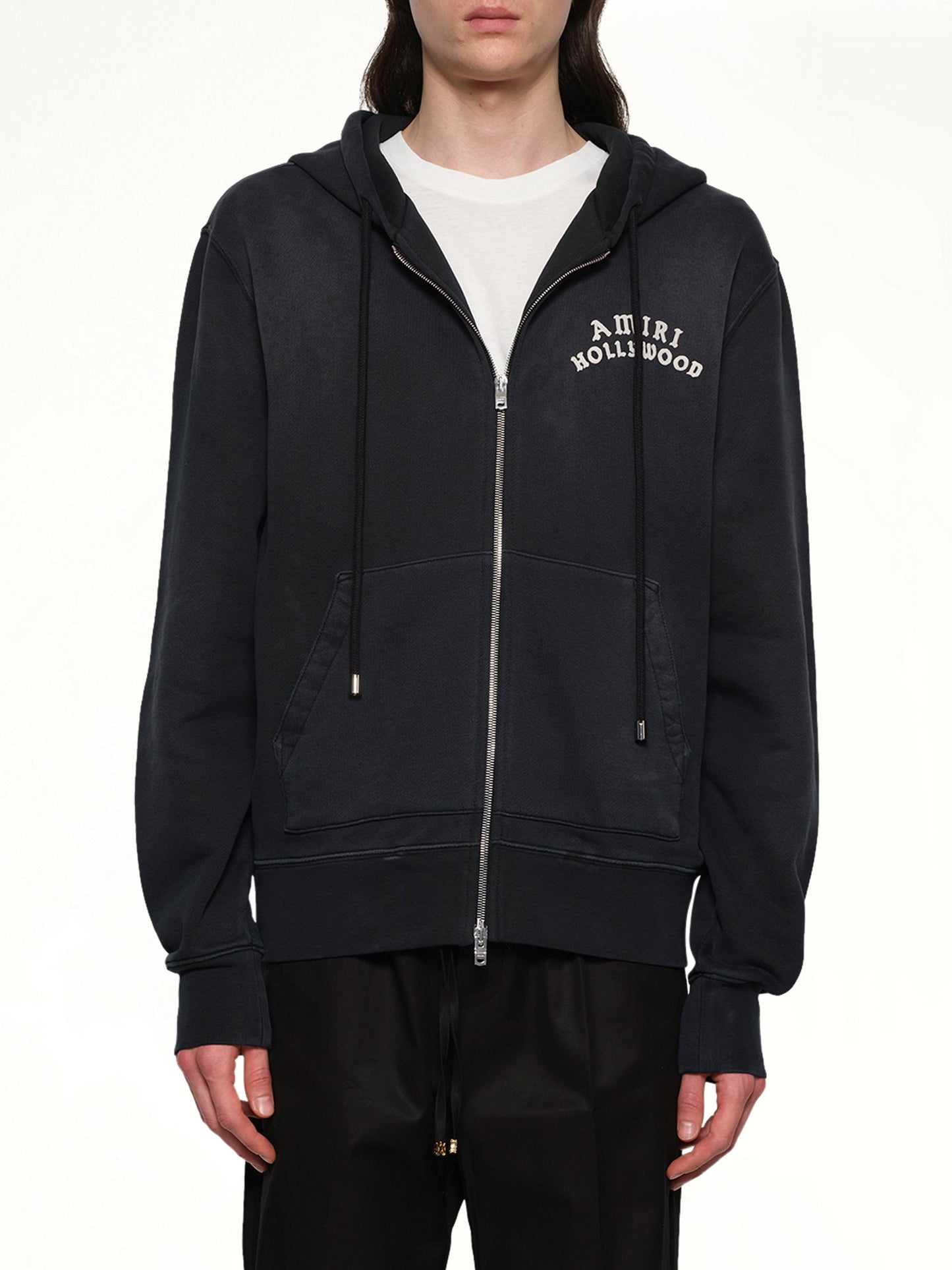 Image of a model wearing Outerwear. Product name - Amiri Hollywood Zip Hoodie in Black colour by brand - AMIRI
